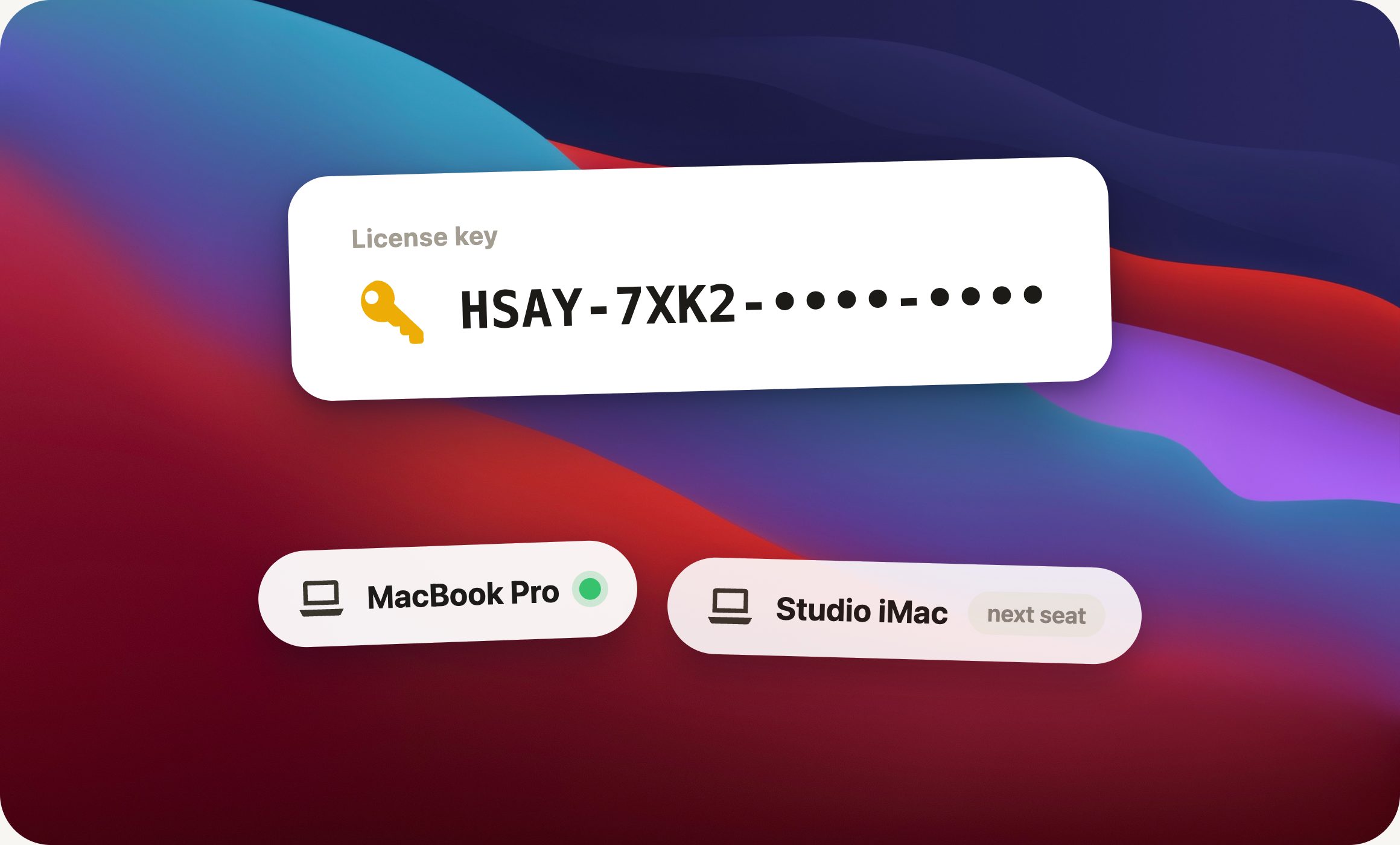 A license key card above two computers, one seat active
